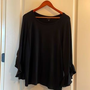 Black top with ruffle-sleeve detail